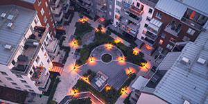 Aerial view of apartment buildings around an inner yard in the evening. Aerial view of apartment buildings around an inner yard in the evening.