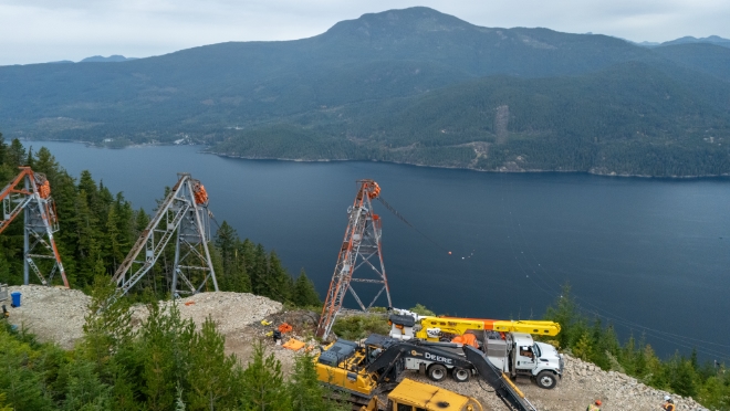 Crews prepare the towers at the Nelson Island side of the line. Crews prepare the towers at the Nelson Island side of the line.