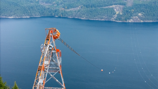 The last remaining conductor next to the parallel 230 kV power line. The 230 kV line will continue to supply power to Powell River and surrounding areas.  The last remaining conductor next to the parallel 230 kV power line. The 230 kV line will continue to supply power to Powell River and surrounding areas.