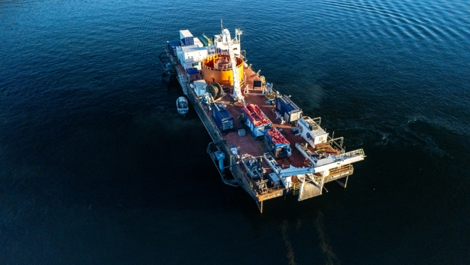 The conductors were retrieved using a barge with a cable reel.  The conductors were retrieved using a barge with a cable reel.