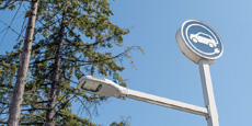 Electric vehicle charging station sign with streetlight at Canadian Superstore Coquitlam. Electric vehicle charging station sign with streetlight at Canadian Superstore Coquitlam.