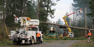 Power line crew working to restore a power outage during a storm.