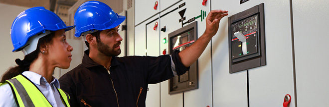 Electrical engineers working at Electrical Distribution Control Room.