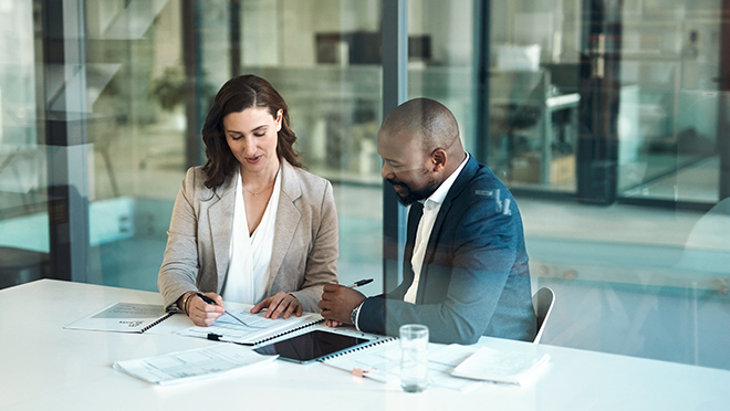 A business people and a clients reviewing some paperwork