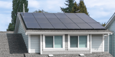 Exterior of residential house with solar panel system installation on roof