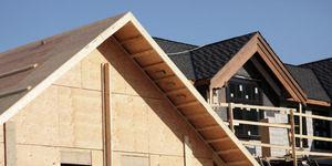 Construction of a wooden house frame.