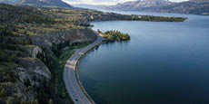 Aerial panoramic view of Okanagan Lake during a sunny summer day.