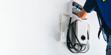 An electrician installing EV charger