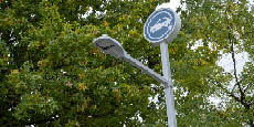 EV charging station sign mounted on a tall post