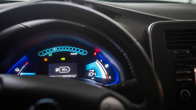 Close up of illuminated dashboard in electric car.