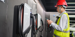 Engineer inspecting an electric vehicle charging stations. Engineer inspecting an electric vehicle charging stations.