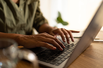 Person typing on a laptop