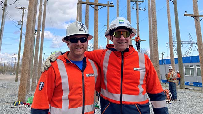 Two BC Hydro power line technicians, Wes Nustad (left) and Curt Minard.